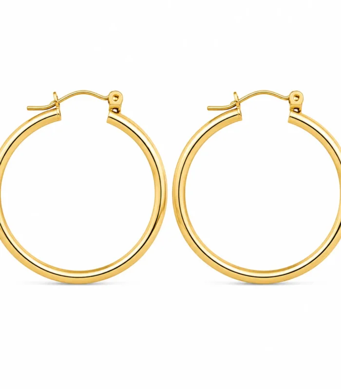 Classic gold hoop earrings with sleek minimalist round design and elegant everyday luxury styling for women.
